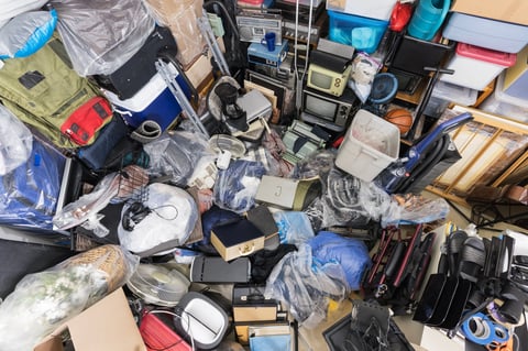 Cluttered basement before cleanup